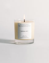 A lit product shot of the Original Self Awake scented candle.