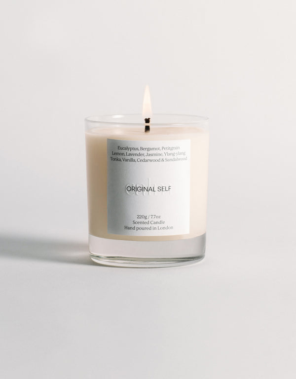 A lit product shot of the Original Self Calm scented candle.
