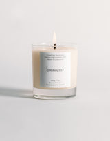 A lit product shot of the Original Self Focus scented candle.