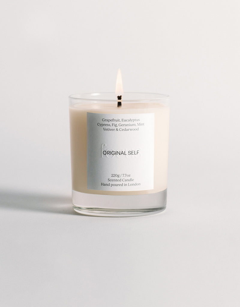 A lit product shot of the Original Self Focus scented candle.